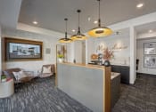 Thumbnail 57 of 58 - a lobby with a reception desk and a wall with a mural