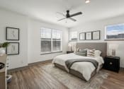 Thumbnail 11 of 58 - a bedroom with a bed and a ceiling fan at Meridian at CityPlace, Woodbury, Minnesota