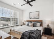 Thumbnail 28 of 40 - a bedroom with a bed and a ceiling fan at Stella, San Tan Valley Arizona