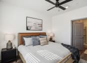 Thumbnail 26 of 40 - a bedroom with a large bed and a ceiling fan at Stella, San Tan Valley Arizona