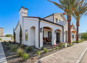 Thumbnail 16 of 40 - the exterior of a house with palm trees and a sidewalk at Stella, San Tan Valley, AZ 85143