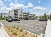 Thumbnail 44 of 49 - an empty parking lot in front of an apartment building at Drift, Daytona Beach, FL, 32117
