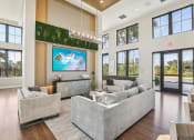 Thumbnail 37 of 49 - a living room with couches and a tv on the wall at Drift, Daytona Beach, FL, 32117