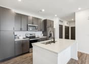 Thumbnail 48 of 49 - a kitchen with a marble floor and black and white at Drift, Daytona Beach, FL, 32117