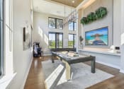 Thumbnail 47 of 49 - a billiards table in a living room with a view of the pool table at Drift, Daytona Beach, FL, 32117