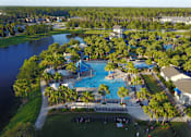 Thumbnail 122 of 124 - Resort style pool with water slides and palm trees at Velara Luxury Apartments, Ponte Vedra Beach, FL 32081