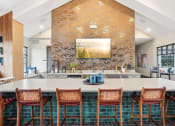 Thumbnail 36 of 56 - a kitchen with a large island and bar chairs at Notch66, Longmont, Colorado