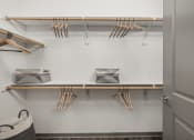 Thumbnail 21 of 56 - a walk in closet with wooden shelves and utensils hanging on the wall at Notch66, Longmont, Colorado