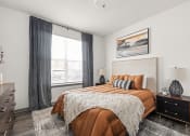 Thumbnail 22 of 56 - a bedroom with a bed and a large window at Notch66, Longmont, Colorado