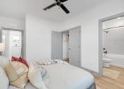 Thumbnail 50 of 58 - a bedroom with a large bed and a ceiling fan at Meridian at CityPlace, Minnesota, 55125