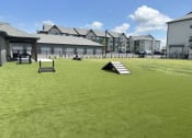 Thumbnail 10 of 88 - a large lawn with a ramp in the middle of it at The Depot Raymore, MO 64083