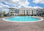 Thumbnail 15 of 56 - Swimming Pool And Sundeck at Watermark at Steele Crossing, Fayetteville