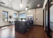 Thumbnail 70 of 88 - a conference room with a long table and chairs and a window at The Depot in The Depot Raymore, MO 64083