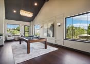 Thumbnail 66 of 88 - a game room with a pool table and large windows at The Depot in The Depot Raymore, MO 64083