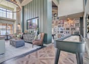 Thumbnail 6 of 30 - Clubhouse with a foosball table and a couch at Canter, Ocala, FL, Florida, 34474