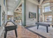 Thumbnail 17 of 30 - a game room with two shuffleboards and a pool table at Canter, Florida, 34474