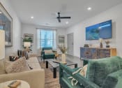 Thumbnail 20 of 30 - a living room with couches and chairs and a tv at Canter, Ocala, 34474