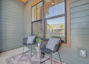 Thumbnail 7 of 30 - a patio with two chairs and a window at Canter, Florida