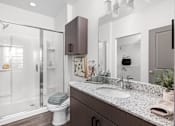 Thumbnail 14 of 36 - A modern bathroom with a walk-in shower and double sink vanity.