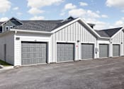 Thumbnail 12 of 36 - A row of garage doors are closed.
