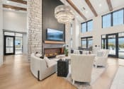 Thumbnail 24 of 53 - a living room with couches and chairs and a fireplace at The Garrison Luxury Apartment Homes, Colorado