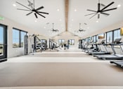 Thumbnail 47 of 53 - a gym with treadmills and other exercise equipment at The Garrison Luxury Apartment Homes, Fountain