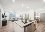 Thumbnail 10 of 53 - an open floorplan with a kitchen and living room at The Garrison Luxury Apartment Homes, Fountain