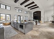 Thumbnail 16 of 115 - A modern kitchen with a large island and a fireplace. at Terrassa Luxury Apartments, Florida, 32084