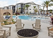 Thumbnail 6 of 115 - Poolside Firepit Patio at Terrassa Luxury Apartments, St. Augustine