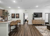 Thumbnail 50 of 115 - A modern kitchen with wooden floors and furniture. at Terrassa Luxury Apartments, St. Augustine