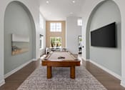 Thumbnail 62 of 68 - A billiard table is in the middle of a room with arched walls.