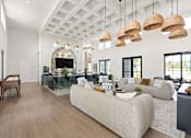 Thumbnail 65 of 68 - A modern living room with a large sectional sofa and a wooden floor.