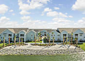 Thumbnail 82 of 83 - A row of houses with a body of water in front. at Junction Apartments in Rockledge, FL