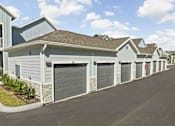 Thumbnail 80 of 83 - A row of houses with garages on the side. at Junction Apartments in Rockledge, FL
