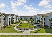 Thumbnail 74 of 83 - A row of houses with a garden in the foreground. at Junction Apartments in Rockledge, FL