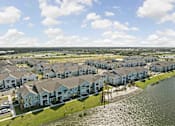 Thumbnail 75 of 83 - A row of houses with a body of water in front. at Junction Apartments in Rockledge, FL