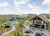 Thumbnail 1 of 83 - A large house with a pool and a patio area. at Junction Apartments in Rockledge, FL