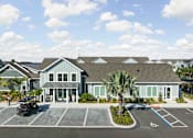Thumbnail 83 of 83 - A building with a parking lot in front of it. at Junction Apartments in Rockledge, FL