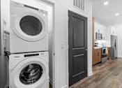 Thumbnail 64 of 83 - A white Whirlpool washing machine and dryer in a modern laundry room. at Junction Apartments in Rockledge, FL