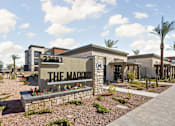 Thumbnail 99 of 108 - The Maddox sign is in front of a building with a clear blue sky in the background.