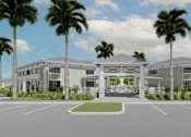 Thumbnail 12 of 13 - A modern building with a white facade and palm trees in front at Verity Luxury Apartment Homes, Vero Beach, Florida