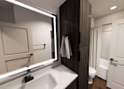 Thumbnail 26 of 34 - A bathroom with a sink, mirror, toilet, and shower at Stack at Wheat Ridge Apartments, Wheat Ridge
