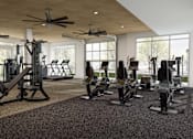 Thumbnail 5 of 34 - A gym with a variety of equipment including treadmills, weights, and exercise machines at Stack at Wheat Ridge Apartments, Wheat Ridge, Colorado