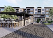 Thumbnail 8 of 34 - A modern building with a patio and a bar at Stack at Wheat Ridge Apartments, Colorado