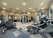 Thumbnail 31 of 56 - spacious gym with cardio equipment at the oxford condos tx at Watermark at Steele Crossing, Fayetteville, Arkansas
