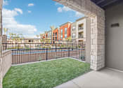 Thumbnail 60 of 108 - our apartments have a spacious balcony with grass and a fence at The Maddox Luxury Apartment Homes, Buckeye Arizona  