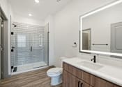 Thumbnail 92 of 108 - a bathroom with a sink and a toilet and a shower at The Maddox Luxury Apartment Homes, Arizona, 85326