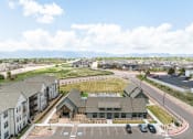 Thumbnail 19 of 38 - an aerial view of a building with cars parked in a parking lot at Upland Flats, Colorado Springs, CO, 80922