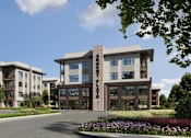 Thumbnail 2 of 32 - A modern apartment complex with a landscaped entrance.