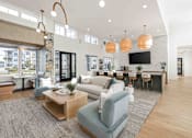 Thumbnail 9 of 61 - A living room with a grey sofa and a wooden coffee table at Verity Luxury Apartments, Vero Beach
